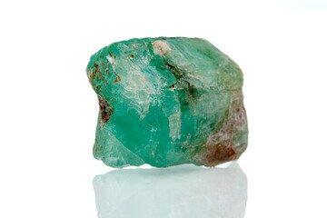macro mineral stone emerald on a white background