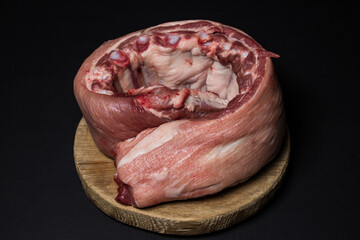 Raw pork ribs on a black background. Fresh pork meat.