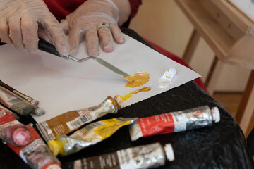 Fototapeta premium Art studio with brushes paint mixing and discussing painting and art.