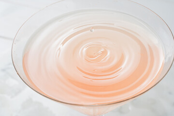 Close-up of grapefruit cocktail with a drop 