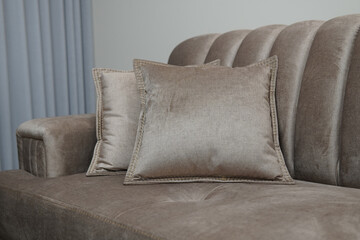 Closeup shot of a decorative beige pillows