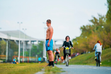 Athletic man of sprinters run on running track at stadium, success