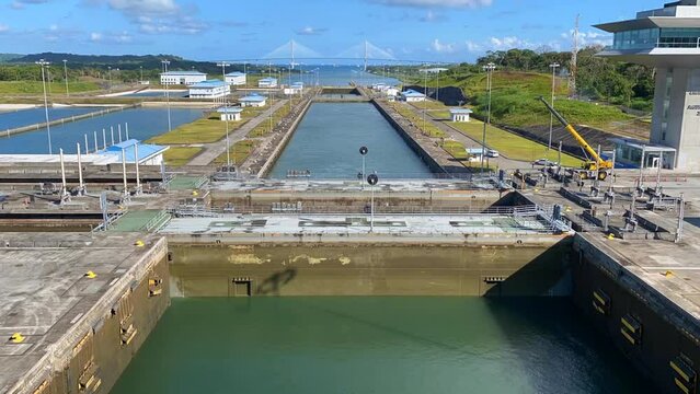 Panama Canal: Timelapse of Agua Clara Locks filling and boat rising. Three new locks with Atlantic Bridge. The Atlantic Locks connect Limon Bay to Gatun Lake, Atlantic to Pacific Oceans.
