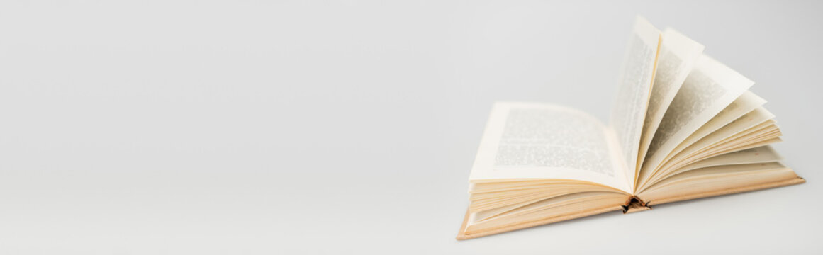 background with open book and copy space on grey, banner.