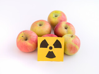 Apples with a radiation warning sign on them