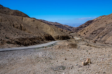 Dangerous mountain road over the abyss. Wadi  Bin Hammad, Moab Plateau, Jordan.