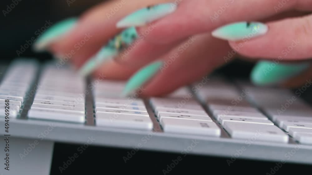 Poster business woman's fingers are typing on the keyboard of a white laptop. the hands of a young girl are