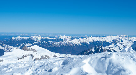 Fototapeta na wymiar View from the peak of Schilthorn in Jungfrau ski arena, Switzerland, over numerous alpine summits