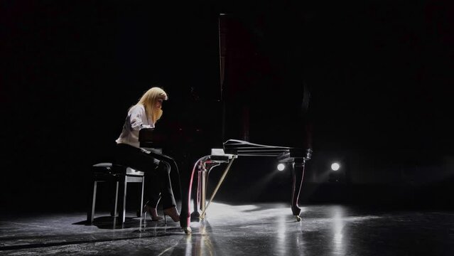 Static shot of a pianist at the piano