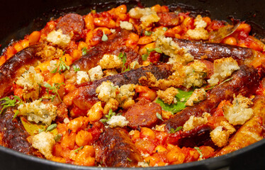 Double sausage and bean casserole with cheese-on-toast crumbs