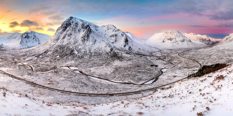 Panoramic view of Buachaille Etive Mor covered in snow on a beautiful Winter morning. Glencoe, Scotland, UK.