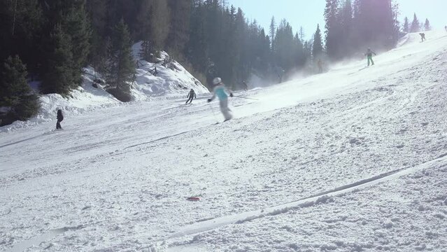 Group of skiers ski down the ski slope