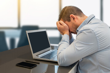 Fototapeta na wymiar Businessman overwhelmed by work. Frustration and despair in the office due to accumulation of tasks