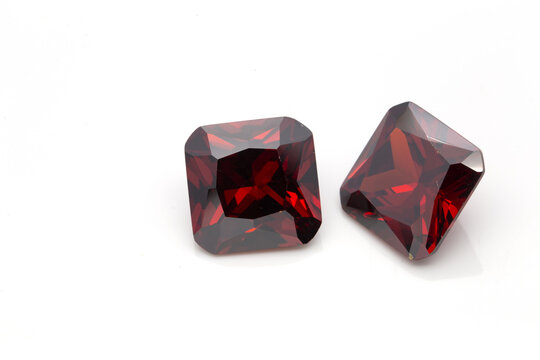 Closeup of red ruby gemstones isolated on a white background