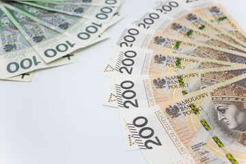 Zloty - Polish banknote. Polish currency on a white background arranged in a pattern. Illustrates cash flow and business