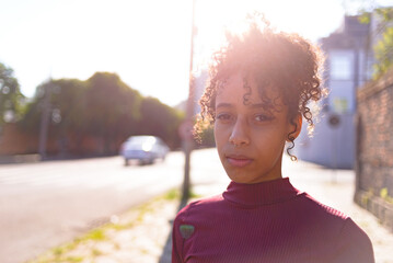 Black young woman portrait outdoors in urban landscape