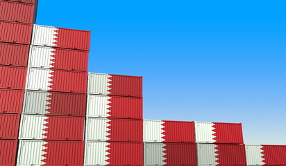 Many containers with flag of Bahrain represent decreasing trend. Economic or industrial crisis concept. 3D rendering