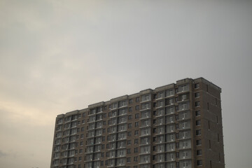 Building against sky. Construction of residential building. One house in frame.