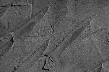 gray background. in the photo, gray decorative plaster on the wall.