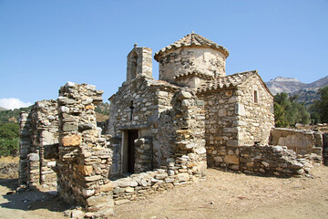 Beautiful exterior view of the old stone brick of the Church of Saint George Diasoritis in Greece