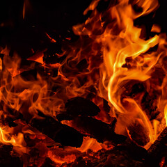 Fire flames on black background, Blaze fire flame texture background, Beautifully, the fire is burning, Fire flames with wood & cow dung © rahul