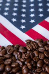 Some black coffee beans on USA flag background