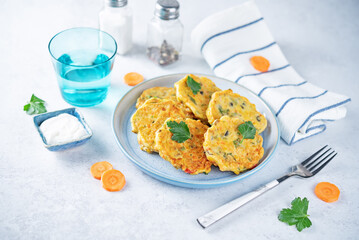 Corn fritters with carrots and parsley