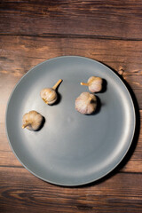 food on a plate on the table apple profiteroles garlic