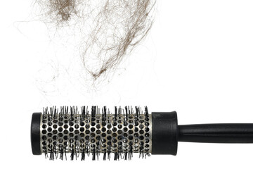 Hair loss problem with round hair brush , isolated on white background. horizontal frame, the hair...