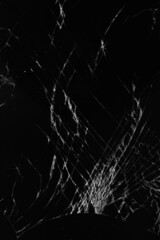 cracks on the broken smartphone screen close-up. Vertical framing option