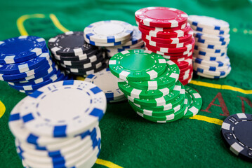  poker chips on a green poker table.