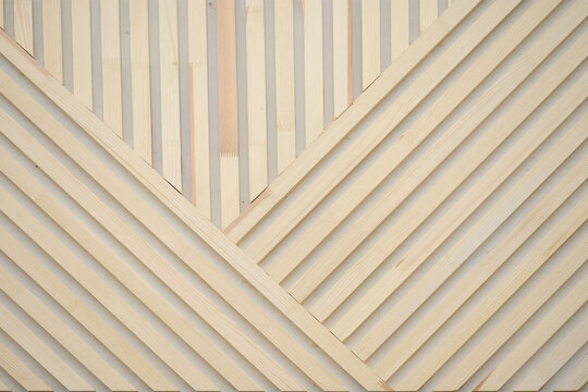 Background of wooden slats. Natural wooden plank on the wall diagonally. texture for background