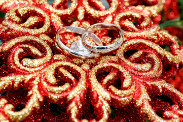 wedding gold rings on a beautiful shiny background