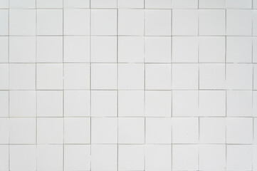 a white textured wall made of three-dimensional square segments.