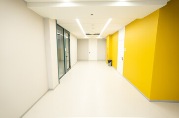 Empty hall in office with yellow walls, covid-19 empty area
