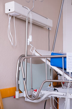 The Headboard Of An Empty Hospital Bed