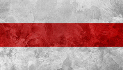 Textured photo of the flag of Belarus, red with white colors. © Lalandrew