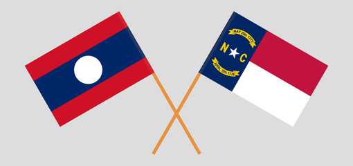 Crossed flags of Laos and The State of North Carolina. Official colors. Correct proportion