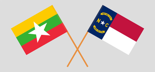 Crossed flags of Myanmar and The State of North Carolina. Official colors. Correct proportion