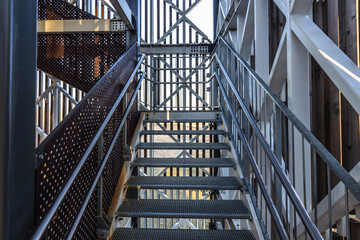 Steel construction with stainless metal railing and fall protection