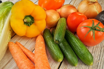 High Angle View of Selection of Fresh Summer Vegetables on a Rustic Wooden Table
