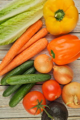Fresh Summer Vegetables on a Rustic Wooden Table, overhead flat lay view