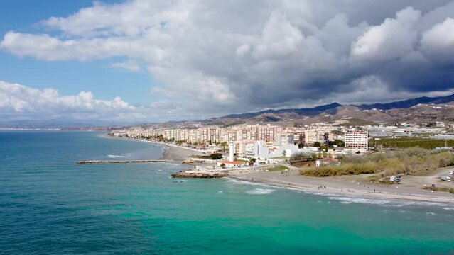 Torrox Costa view from above. Drone footage of this costal city situated in Malaga province, Costa del Sol - Spain. Touristic travel destination. Drone forward