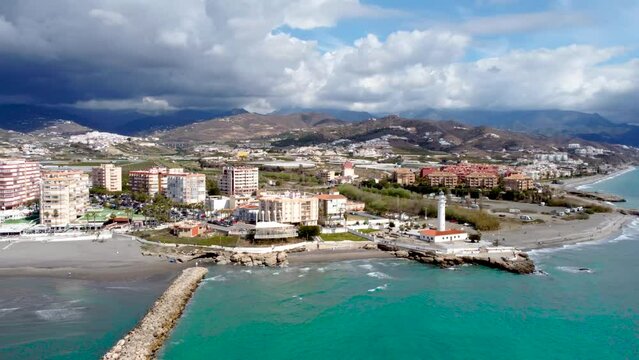 Torrox Costa view from above. Drone footage of this costal city situated in Malaga province, Costa del Sol - Spain. Touristic travel destination. Drone rotating and panning right