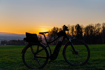 Obraz premium Ebike with sunset light over Ceske Budejovice city in south Bohemia