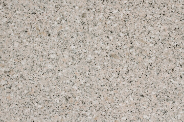 Textured gray granite horizontal background with small black particles.
