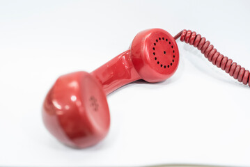old red phone on green or white background