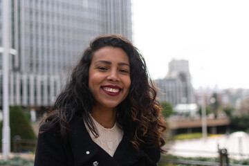 Young beautiful woman portrait, African student girl in a city, Young businesswoman smiling...