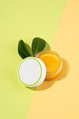 An open tin of foot balm with sheep's wool grease. Lanolin cosmetics for self-care, a jar of...