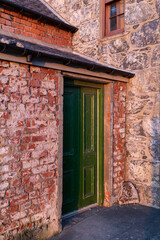 20 March 2022. Crovie, Aberdeenshire, Scotland. This is the row of houses that was the old coastal fishing village of Crove carching the Sun. The ver small village is now mostly holiday homes.
